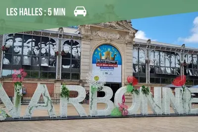 a building with a large sign in front of it at Studio Cosy - Balcon - Wifi - Free parking in Narbonne