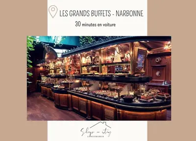 a restaurant with a counter with food on it at Le Canal - Appartement avec vue 4 personnes in La Redorte