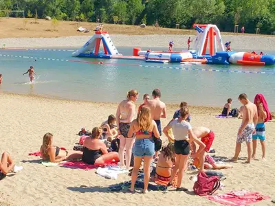a group of people on the beach at the water park at Peaceful Pyrenees Retreat in Quillan