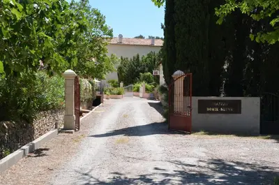 a driveway with a red gate in a house at Marsanne cottage for 2 and 2 people in the heart of the vineyard in Badens