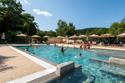 a group of people swimming in a swimming pool at Camping maeva Respire La Serre in Aigues-Vives