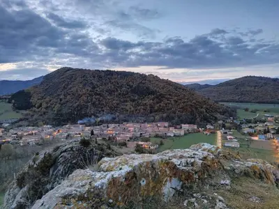 a view of a town on top of a mountain at Lodge tente les pommiers Glamping Ô rendez-vous en demi-pension in Roquefeuil