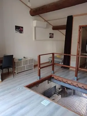 a room with a cage in the middle of a room at Coeur de Fitou Maison de village atypique avec terrasse in Fitou