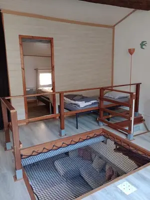 a room with two bunk beds and a mirror at Coeur de Fitou Maison de village atypique avec terrasse in Fitou
