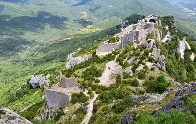 an ancient fortress on the side of a mountain at 1 Bedroom Amazing Home In Saint-Laurent-De-La-Ca in Saint-Laurent-de-la-Cabrerisse