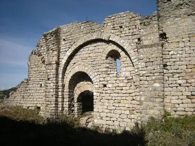 an old stone building with an arch in the middle at Maison Marianne Comfortable holiday residence in Ferrals-lès-Corbières