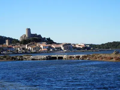 a view of a river with a town in the background at Studio spacieux à Gruissan - Parking - Vue port - Proche plage - FR-1-796-29 in Gruissan