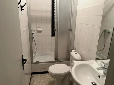 a bathroom with a shower and a toilet and a sink at T2 Climatise en RDC Face Mer 5 Pers PKG - FR-1-797-7 in Port-la-Nouvelle