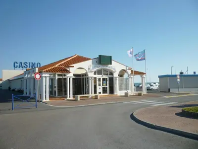 a gas station on the corner of a street at T2 Mezzanine à 250m de la plage pour 4/5 pers avec Parking et TV - FR-1-797-31 in Port-la-Nouvelle