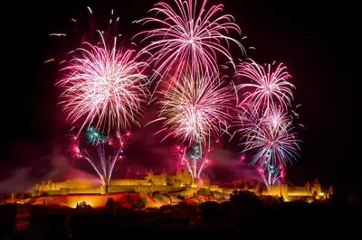 a fireworks display with a castle in the background at Tout confort ! Ville, Calme, Cinéma privé, Climatisation, Parking, WiFi in Carcassonne