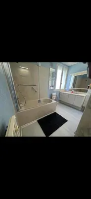 a bathroom with a shower and a bath tub at Hotel Castres Chambre Simple in Castres