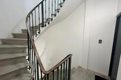 a staircase in a home with white walls at Le Baroque Studio Wifi in Narbonne