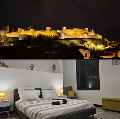 a bedroom with a bed with a picture of a castle at Vue Cité Médiévale Castel View in Carcassonne