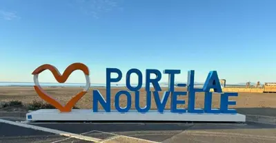 a sign in a parking lot with the words portilla novole at Maison 3 pièces PORT LA NOUVELLE PN080-006 in Port-la-Nouvelle