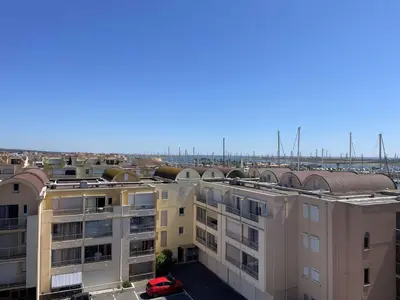 an aerial view of a city with buildings at Appartement climatisé résidence Grande Voile GN160-434 in Gruissan
