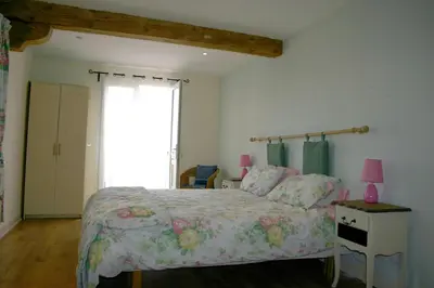 a bedroom with a bed and a window at Domaine de Polf,ages - just for you and your family in Villautou