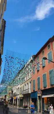 a building with a lot of shoes hanging over it at Villa Serenita in Villemoustaussou