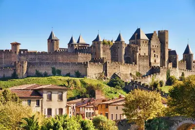 a large castle sitting on top of a hill at Chambres et appartement de charme dans ferme de caractère - billard, jardin et cheminée - près du Canal du Midi in Lagarde