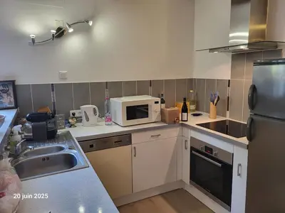 a kitchen with a counter top with a coffee maker at Gîte Coté Village - le cœur du village avec piscine in Salles-d'Aude