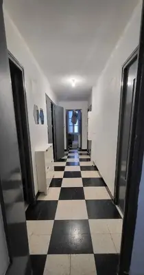 a hallway with a black and white checkered floor at Chambre 1 - avec grande terrasse in Port-la-Nouvelle