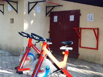 two bikes parked in front of a building at Mobil-Home avec Jacuzzi pour 4 personnes et Terrasse - API-1-52-465 in Sournia