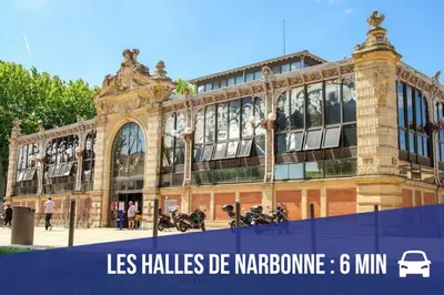 a large building with motorcycles parked in front of it at Gîte Jardin in Narbonne