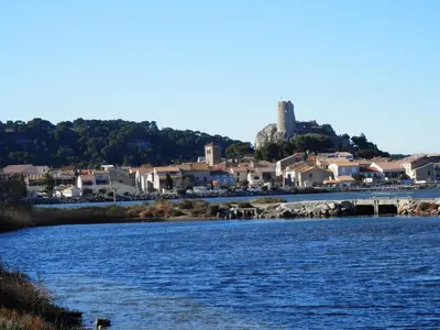 a body of water with a town in the background at Villa T4 Gruissan avec Vue Mer, Climatisée, 80m2, Plage à 50m, 6 Pers. - FR-1-796-100 in Gruissan
