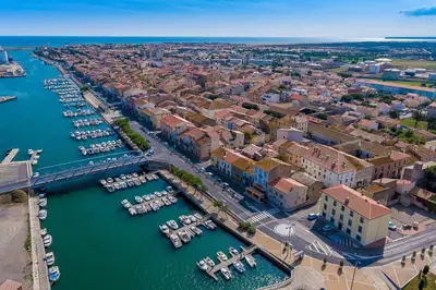 an aerial view of a city with boats in the water at Nice Apt close to the beaches of Port-la-Nouvelle in Port-la-Nouvelle