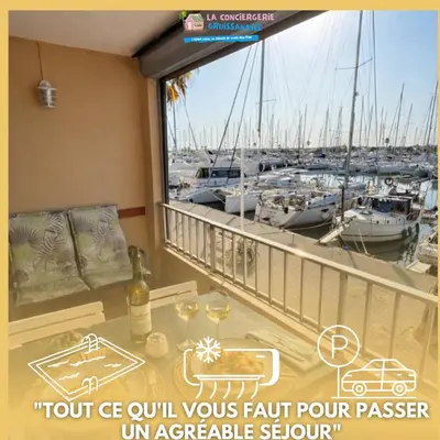 a balcony with a view of a marina with boats at NOUVEAU 