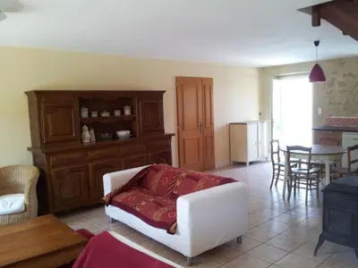 a living room with a white couch and a table at Holiday Home Gemütliches Ferienhaus in Villautou by Interhome in Villautou