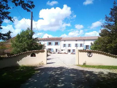 a large white building with a fence in front of it at Holiday Home Schönes Ferienhaus mit Pool in Villautou by Interhome in Villautou
