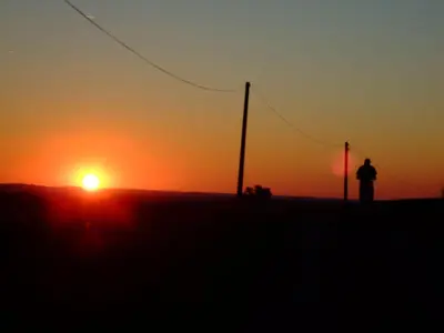 a man standing on a hill watching the sunset at Holiday Home für 2 Personen und 2 Kinder by Interhome in Villautou