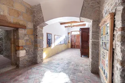 a hallway of a house with a stone wall at Studio du couvent des carmes in Narbonne