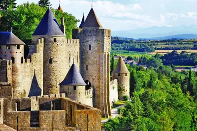 a castle in the middle of a forest at City'IN Appart in Carcassonne