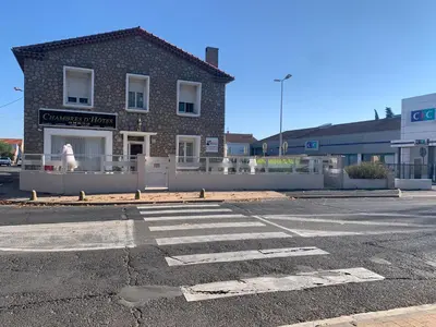 an empty parking lot in front of a building at Le Marty in Narbonne