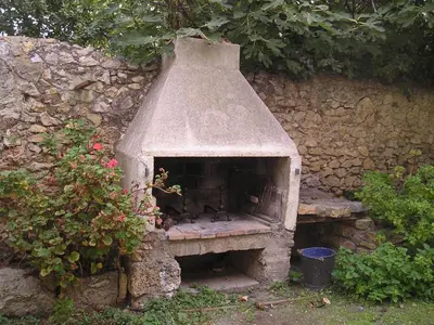 a stone oven with animals sitting on it at GITE PAPY ALBERT in Gruissan