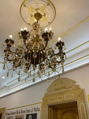 a chandelier hanging from a ceiling in a building at Chambre Lyre Maison de L'Église du Couvent in Narbonne