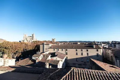 a view of a city from the roofs of buildings at Chambre a Baldaquin Maison de L'Église Du couvent in Narbonne