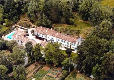 an aerial view of a house with a swimming pool at The Courtyard in Castres