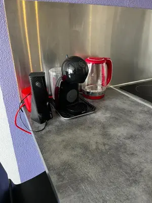 a kitchen counter with a coffee maker and a blender at APPARTEMENT SUR LE PORT DE Gruissan in Gruissan