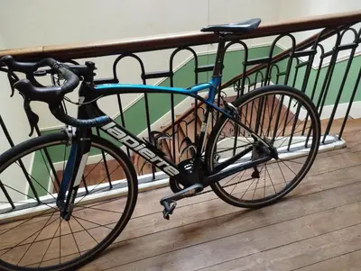 a bike parked next to a fence at Maison Alba La Source in Mazamet