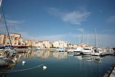 a bunch of boats are docked in a marina at Saphir de Gruissan in Gruissan