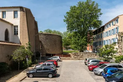 a row of cars parked in a parking lot at Le Cocon / Free Parking / Wifi / Netflix in Carcassonne