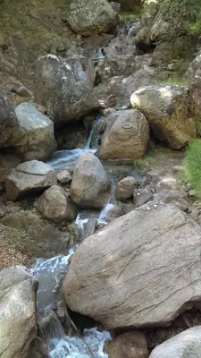 a stream of water with rocks on a mountain at le balcon in Camps-sur-lʼAgly