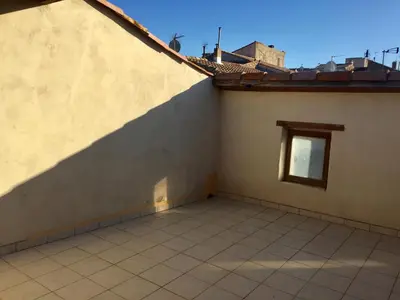 a small window on the side of a building at Maison Ventenac village house in Ventenac en Minervois