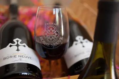 a group of three bottles of wine on a table at Marrakech Guest Room in the heart of the vineyard in Badens