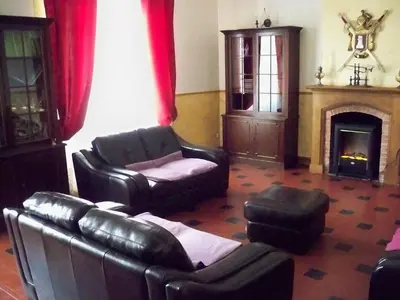 a living room with leather furniture and a fireplace at Le Havre Guest room in the heart of the vineyard no2307 in Badens