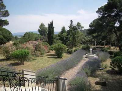 a garden with purple flowers and a fence at Wellington Guest Room in the heart of the vineyard no1205 in Badens