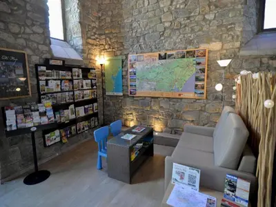 a room with a couch and a map on the wall at Apartment in Azille near Lac de Jouarres in Azille